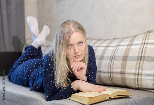 A woman lying on a sofa