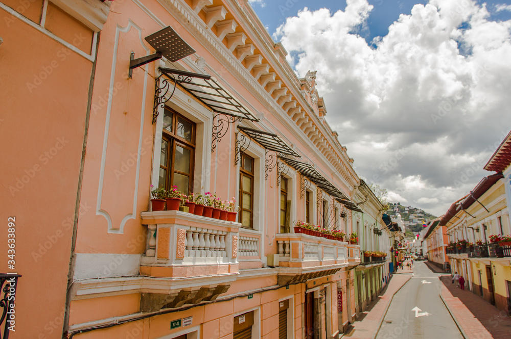 QUITO, ECUADOR - SEPTEMBER 10, 2017: Beautiful view of colonial houses with some beautiful plants in the balcony, located in the city of Quito