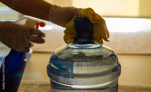 Photography The woman disinfects the carboy