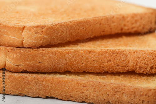 Toast biscuits over white background crunchy food