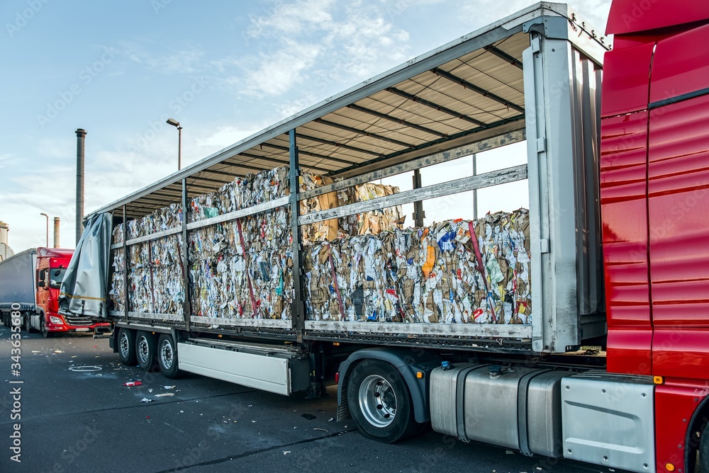 Recycle industry . Paper and cardboard for recycling . Truck Loading Dock