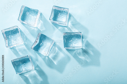 Colored banner with fresh ice cubes and reflections
