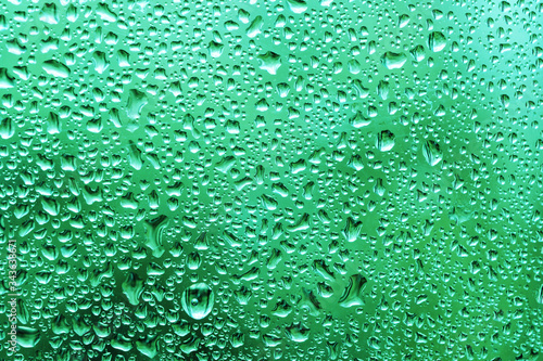 Water drops on the window glass after summer rain background