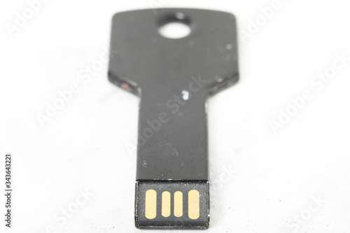 Black flash drive on white background data storage