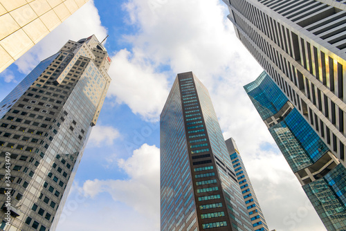 Modern buildings of Singapore skyline landscape in business district with blue sky.