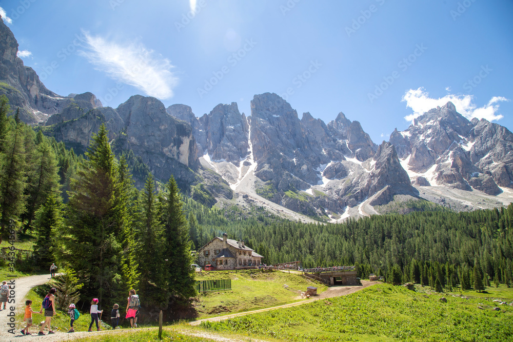trekking in Val Venegia. In the background great view of the Pale di San Martino Dolomites Italy
