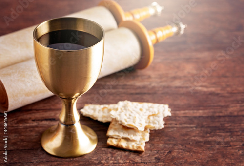 Communion or the Lords Supper Prepared on a Dark Wood Table with an Antique Scroll