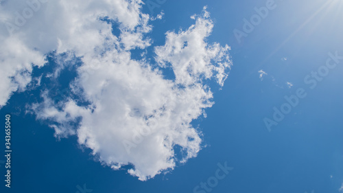Puffy white clouds and clear deep blue sky in summer with copy space background 