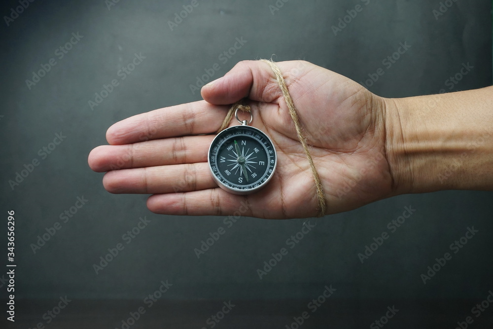 Fototapeta premium Close Up Of Hand holding Magnetic Compass, Selective Focus