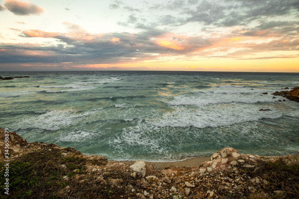 Dramatic sunset sunrise landscape with orange sun over the sea in Punta Cana, Dominican republic Dramatic sunset sunrise landscape with orange sun over the sea in Punta Cana, Dominican republic