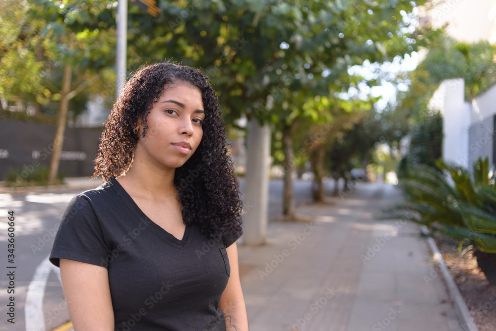 Black woman on urban background in casual clothing Black woman on urban background in casual clothing