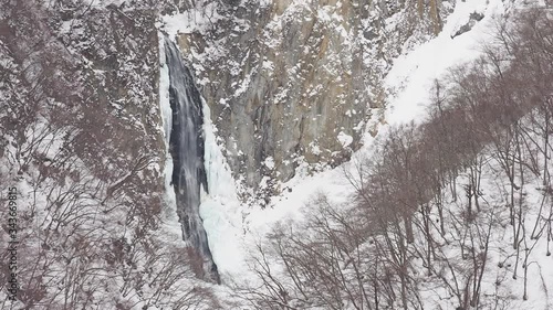 4K footage of Kanman fall in winter located Shigakogen in Nagano, Japan photo