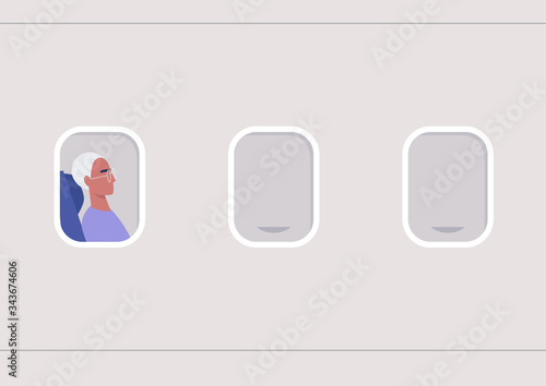 A portrait of a young male passenger in the illuminator frame, travel concept