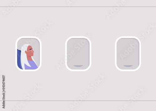 A portrait of a young female passenger in the illuminator frame, travel concept