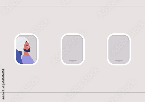A portrait of a young indian male passenger in the illuminator frame, travel concept