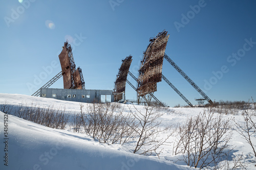 Abandoned troposphere station. Huge antennas of tropospheric communication on top of a mountain. The ruins of an old communication station in the north-east of Russia. Magadan, Magadan Region, Siberia photo