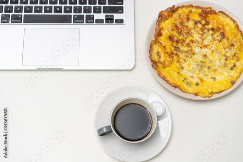 Chinese breakfast placed in front of computer desktop