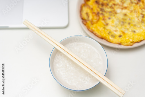 Chinese breakfast placed in front of computer desktop