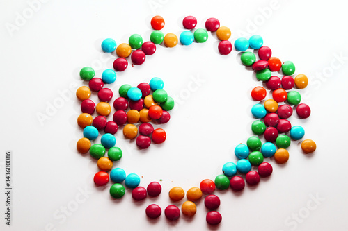 Colorful milk chocolate on white background