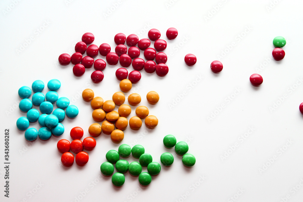 Colorful milk chocolate on white background Colorful milk chocolate on white background