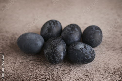 Dark easter eggs on gray background