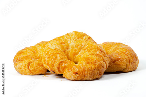 Three Homemade Croissants on a White Background