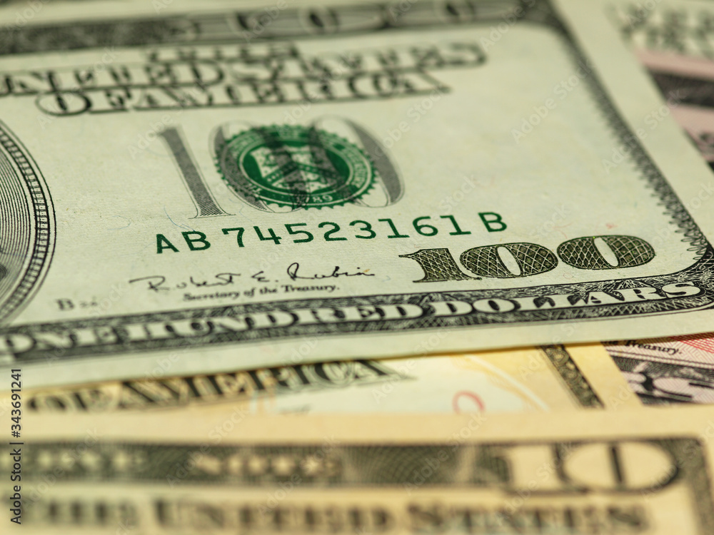 Colorful background with money US dollars of different value. Top view of business concept with finance for banks. American banknotes 5, 10, 50, 100 dollars backdrop Colorful background with money US dollars of different value. Top view of business concept with finance for banks. American banknotes 5, 10, 50, 100 dollars backdrop