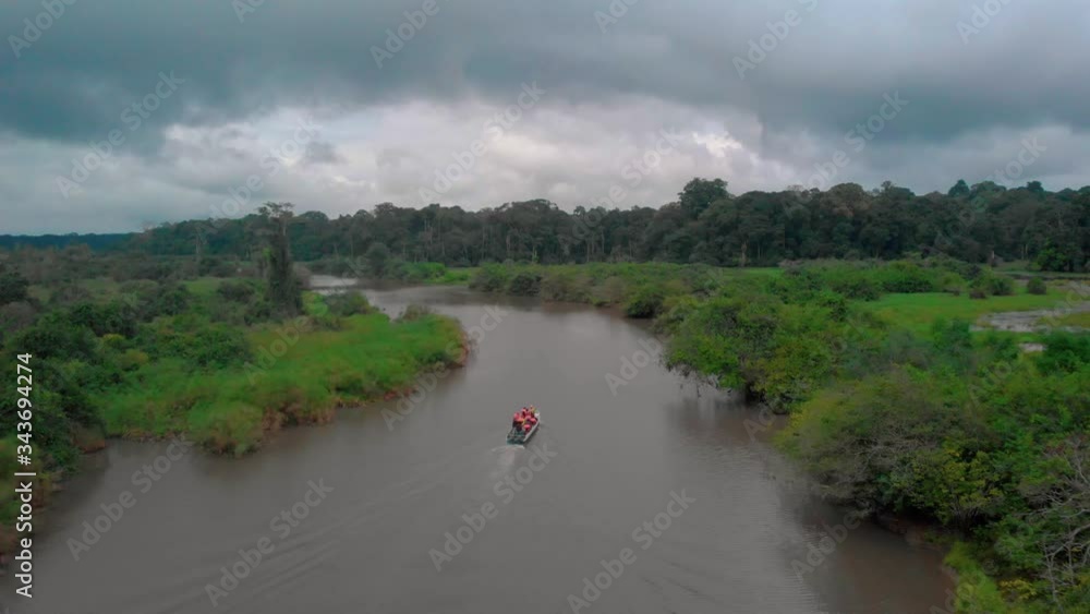 View of the jungle in Loango National Park, drone shot of a boat cruise in Gabon View of the jungle in Loango National Park, drone shot of a boat cruise in Gabon