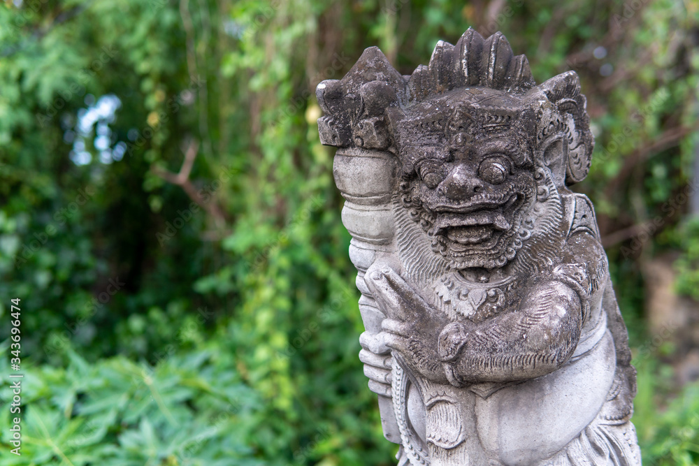 Hindu statue and trees in background