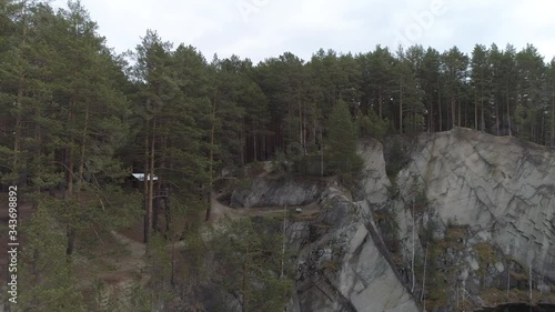 People go over the rocks of talc and Lake Talc Stone in Sysert city. Aerial Russia, Sverdlovsk region photo