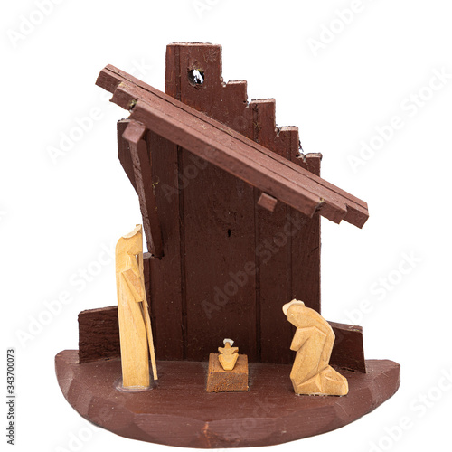 wooden nativity scene on white background, holy family carved in wood
 photo