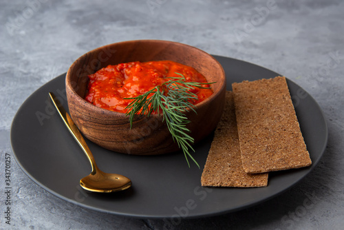 Ajvar, Lutenitsa, Pinjur, Harissa with bread on a plate