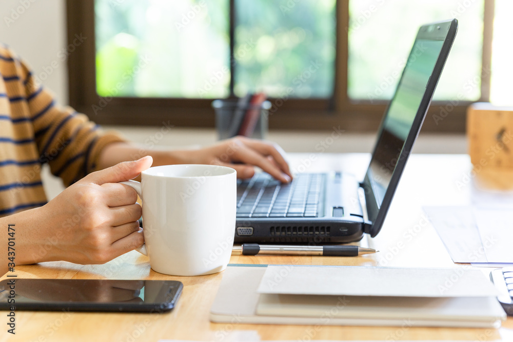 Close up of hands of a young man working with black laptop. Close up of hands of a young man working with black laptop.