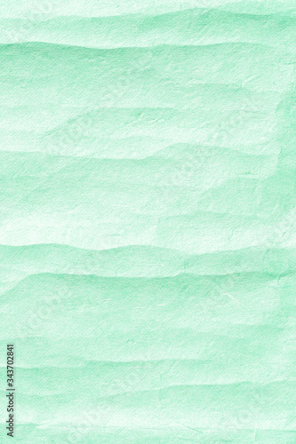 Green vertical crumpled paper background texture © paladin1212