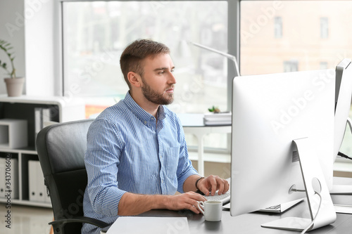 Male programmer working in ...