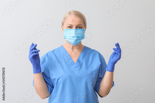 Mature female doctor on lig...
