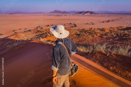Looking at Sesriem at sunset from the top of the Elim dune in Namibia in Africa. photo
