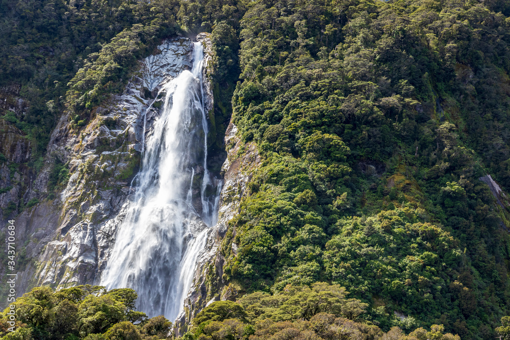 Waterfall at Milford sound  in New Zealand. South Island.