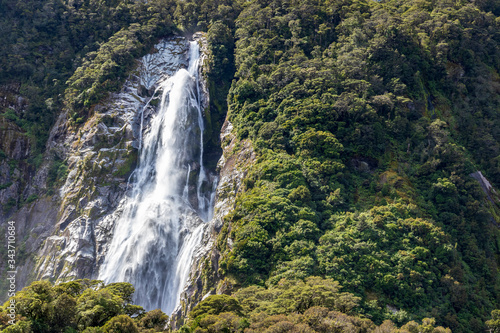 Waterfall at Milford sound  in New Zealand. South Island.