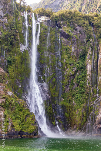 Waterfall at Milford sound  in New Zealand. South Island.