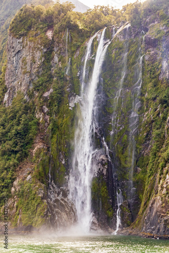 Waterfall at Milford sound in New Zealand. South Island.