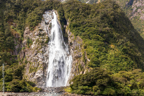 Waterfall at Milford sound in New Zealand. South Island.