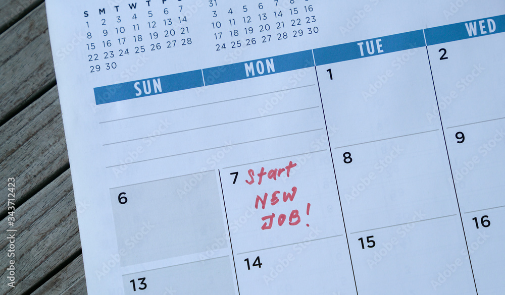 Start new job words written on table calendar with red marker Start new job words written on table calendar with red marker