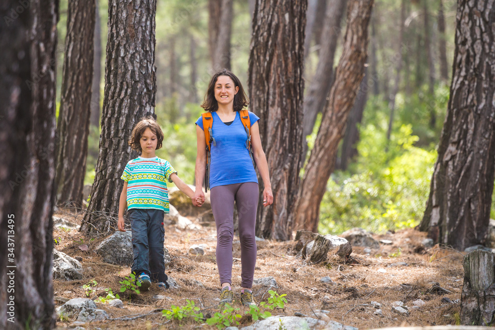 A child with his mother go hiking. A child with his mother go hiking.