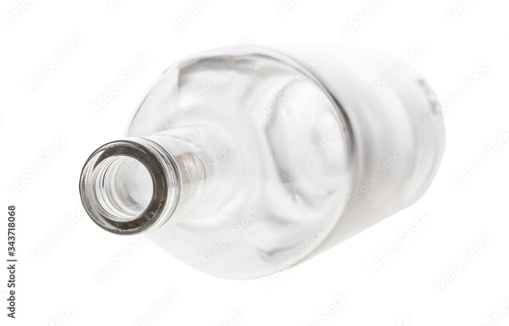 overturned empty clear bottle isolated on white background overturned empty clear bottle isolated on white background