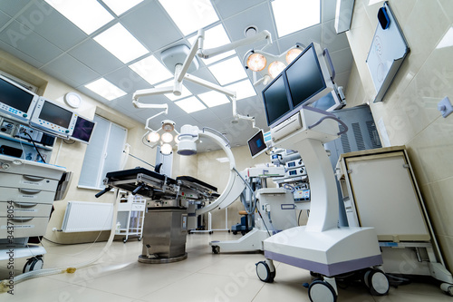 Surgical room in hospital with robotic technology equipment, machine arm surgeon in futuristic operation room. Minimal invasive surgical innovation, medical robot surgery with endoscopy