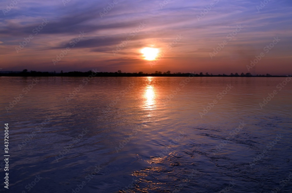 Naklejka premium sunset on the river