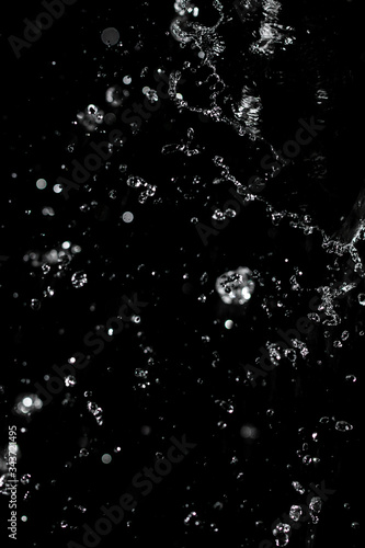 jet of water with splashes on a black background