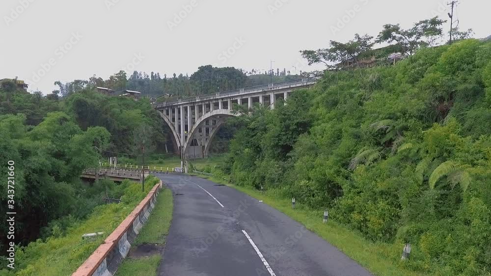 the construction of the beautiful Sigandul bridge in temanggung in central java is in front of a beautiful mountain the construction of the beautiful Sigandul bridge in temanggung in central java is in front of a beautiful mountain