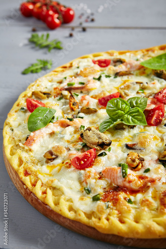 Seafood pizza on wooden board